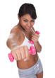 Young Woman Exercising With Dumbbells