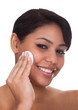 Young Woman Wiping Face With A...
