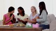 Woman receiving a gift for her birthday party