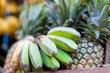 Photo: Bananas and pineapple on market Bananas and pineapple on market
