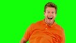 Handsome man jumping on green screen