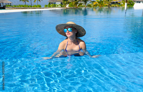 Photo: Woman at poolside Woman at poolside