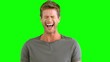 Man laughing on green screen