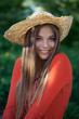 Cute girl in a straw hat