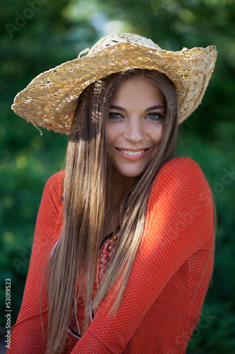 Photo: Cute girl in a straw hat Cute girl in a straw hat