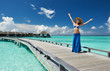 Woman on a beach jetty at Maldives