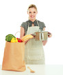 Photo: Woman standing on a kitchen and holding a pan Woman standing on a kitchen and holding a pan
