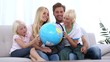 Video: Family looking at globe together Family looking at globe together
