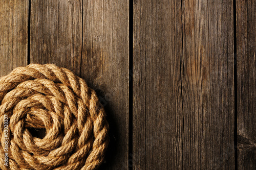 Photo: Rope over wooden background Rope over wooden background