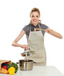 Photo: Woman standing on a kitchen and holding a spoon Woman standing on a kitchen and holding a spoon