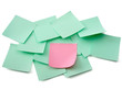 A pink and green  notes, isolated on white background