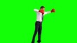 Businessman jumping with boxing gloves and punching
