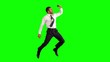 Businessman taking self portrait while jumping