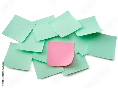 Photo: A pink and green notes, isolated on white background A pink and green notes, isolated on white background