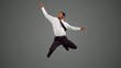 Businessman jumping and listening to music and disco dancing