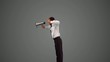 Businessman holding megaphone and jumping on grey background