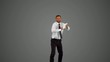 Businessman holding digital tablet jumping on grey background