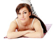 Foto: A young sportive girl lying on the floor A young sportive girl lying on the floor