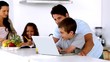 Father looking at laptop with son