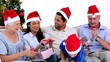 Family swapping gifts at christmas