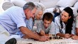 Extended family playing chess together