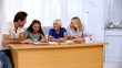 Parents helping their children with homework