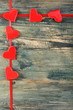 Hearts on a red ribbon.