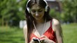 young beautiful woman listening to music and dancing
