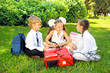 Portrait of schoolboy and schoolgirls  in the park