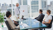 Foto: Manager pointing at a chart during a meeting Manager pointing at a chart during a meeting