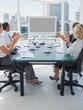 Business people applauding during a video conference