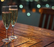 Photo: Champagne in the glasses on the table Champagne in the glasses on the table