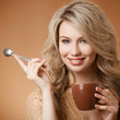 Stylish woman with an aromatic coffee in hands