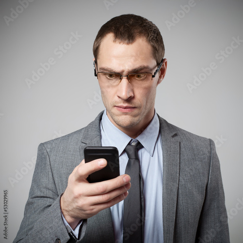 Photo: Man using mobile smart phone Man using mobile smart phone