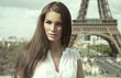 Sepia photo of fashion woman in romantic city