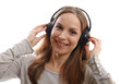Young woman listening music with headphones, on white