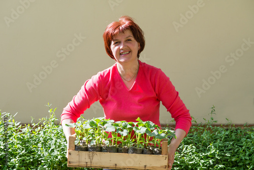 Photo: women holding a crate women holding a crate