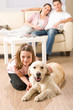 A happy family of three with dog