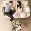 Joyful couple sitting in the morning