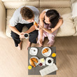 Carefree couple eating breakfast together