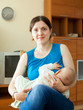 Mother breast feeding her seven-month baby