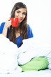 Woman hold coffee cup, seating in bed - white background isolat