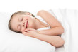 cheerful girl in white bed