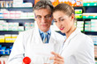 Two pharmacists in pharmacy consulting