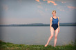 Young girl in athletic swimsuit