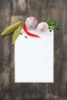 Spices and garlic on wooden background with paper for notes
