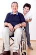 Woman pushing wheelchair