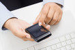 Business woman hands with smart phone at office