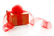 Present box with ribbon curl isolated on white