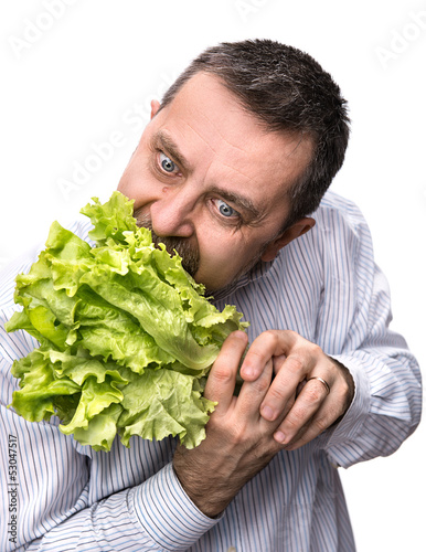 Photo: Man holding lettuce isolated on white Man holding lettuce isolated on white